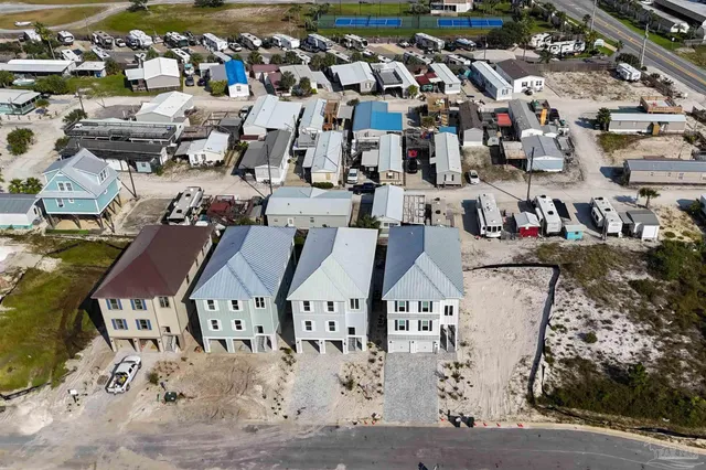 a view of a livingroom with furniture and a window