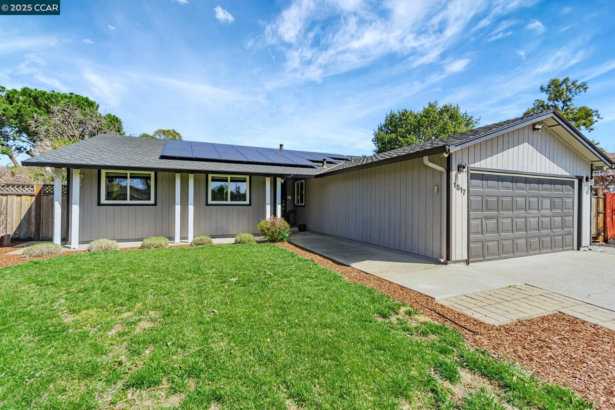 1817 Concord Court Concord, CA 94521 - Photo 1 of 34 a front view of a house with a garden