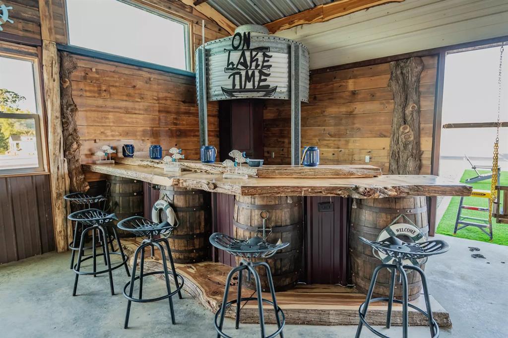 Lot 61 Rocco Dr Mount Mount Pleasant, TX 75455 - Photo 8 of 24 a table with chairs and a stove