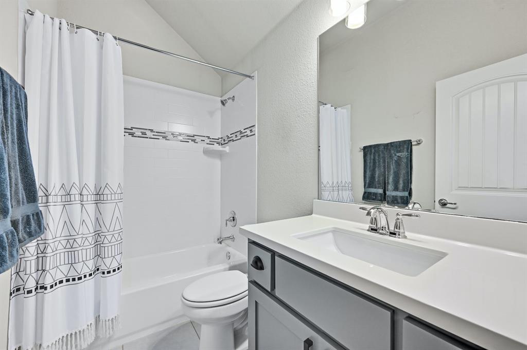629 Germander Road Leander, TX 78641 - Photo 21 of 38 a bathroom with a sink toilet and shower
