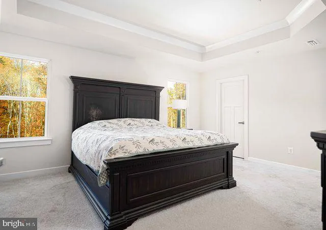 an empty room with wooden floor and closet