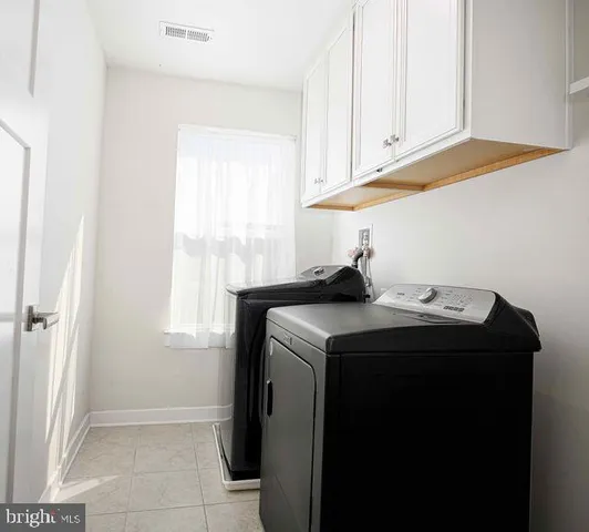 a view of empty room with windows