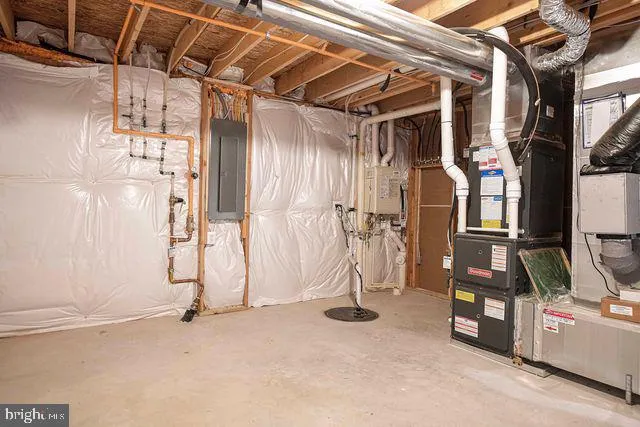 a bathroom with a sink a mirror a toilet and shower