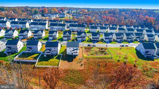 a sign that is sitting in front of flowers