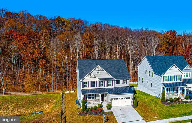 a view of a house with pool and sitting area