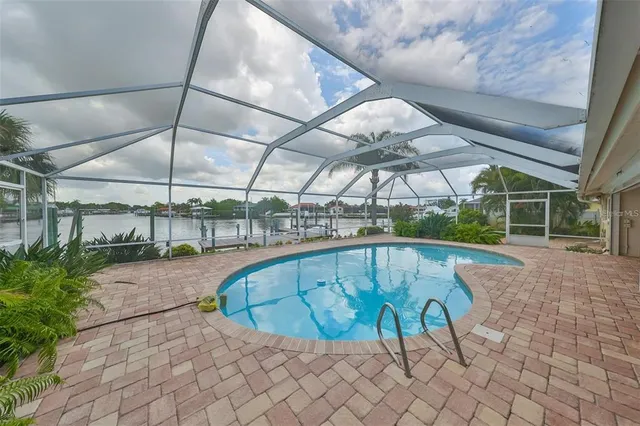 a view of a swimming pool with a patio