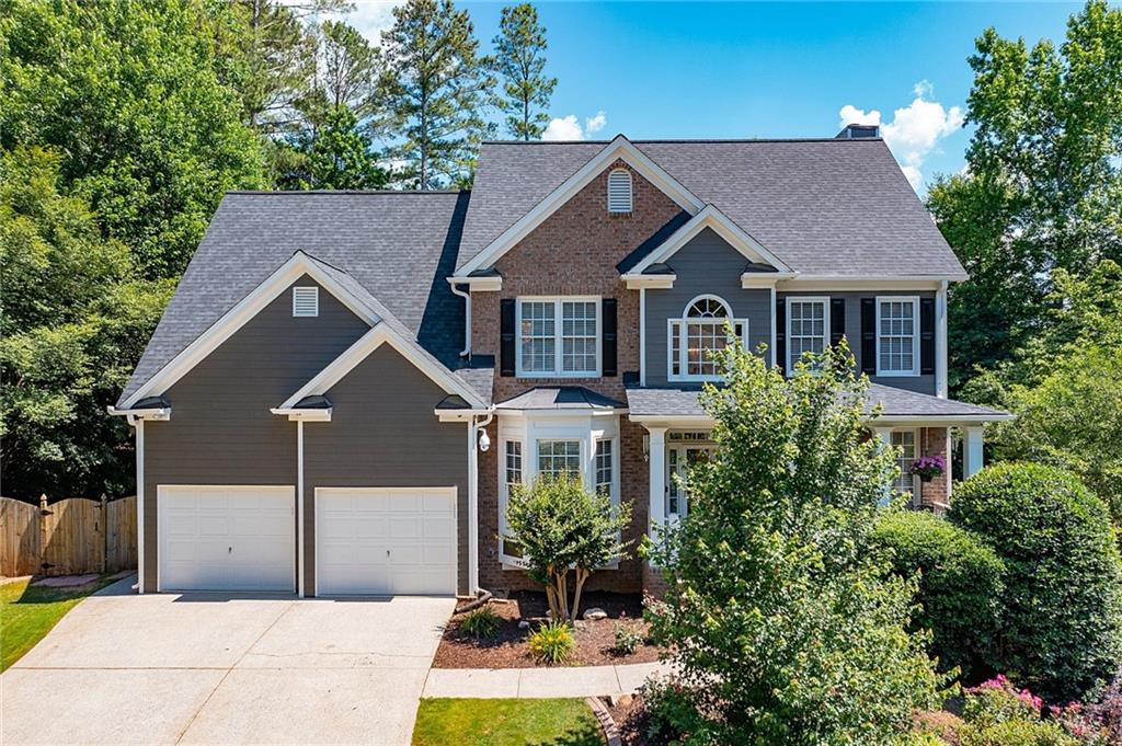 445 Redfield Drive Canton, GA 30114 - Photo 1 of 1 a house view with a garden