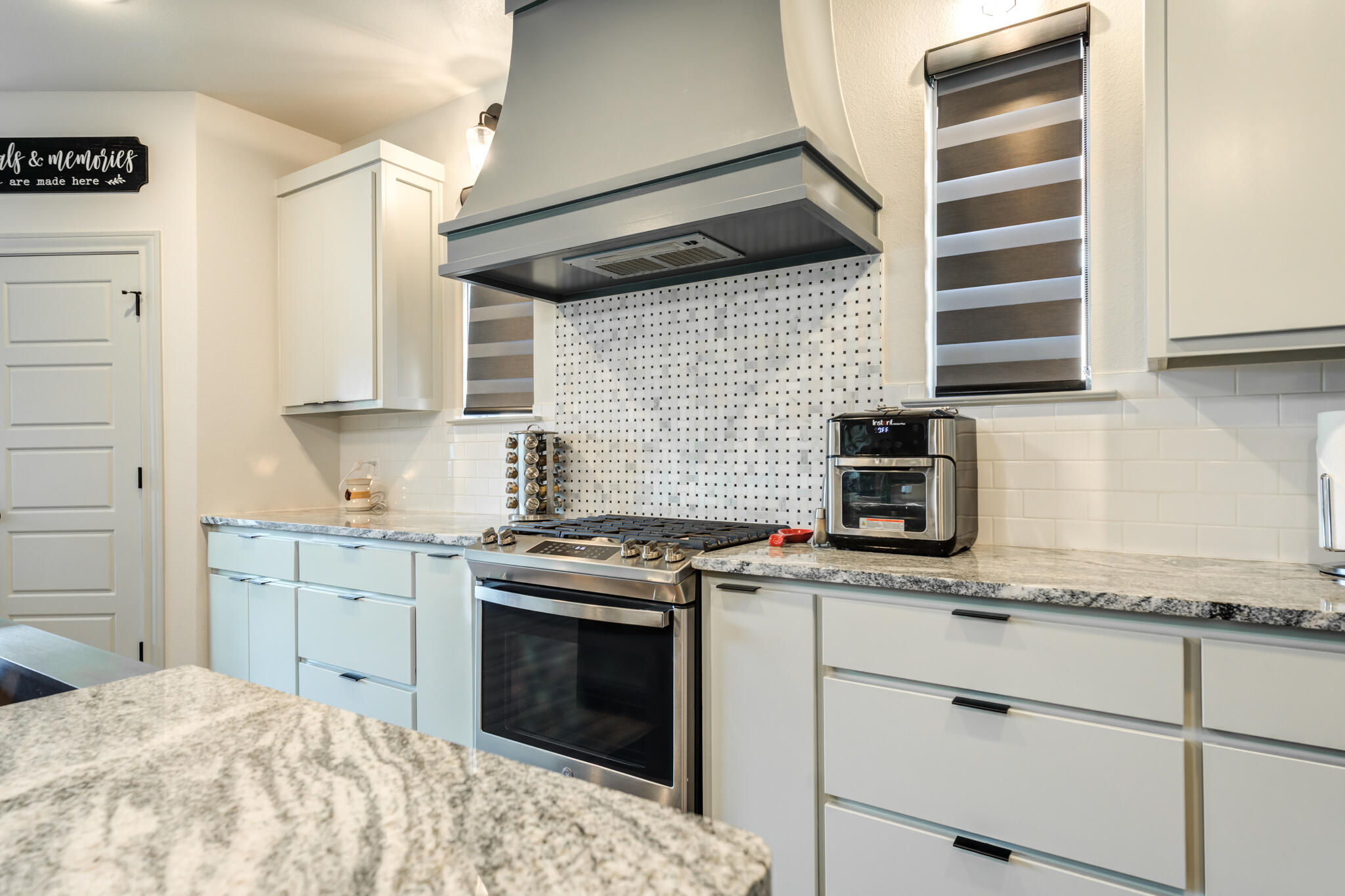 5722 118th Street Lubbock, TX 79424 - Photo 12 of 30 a kitchen with granite countertop cabinets stainless steel appliances and a sink