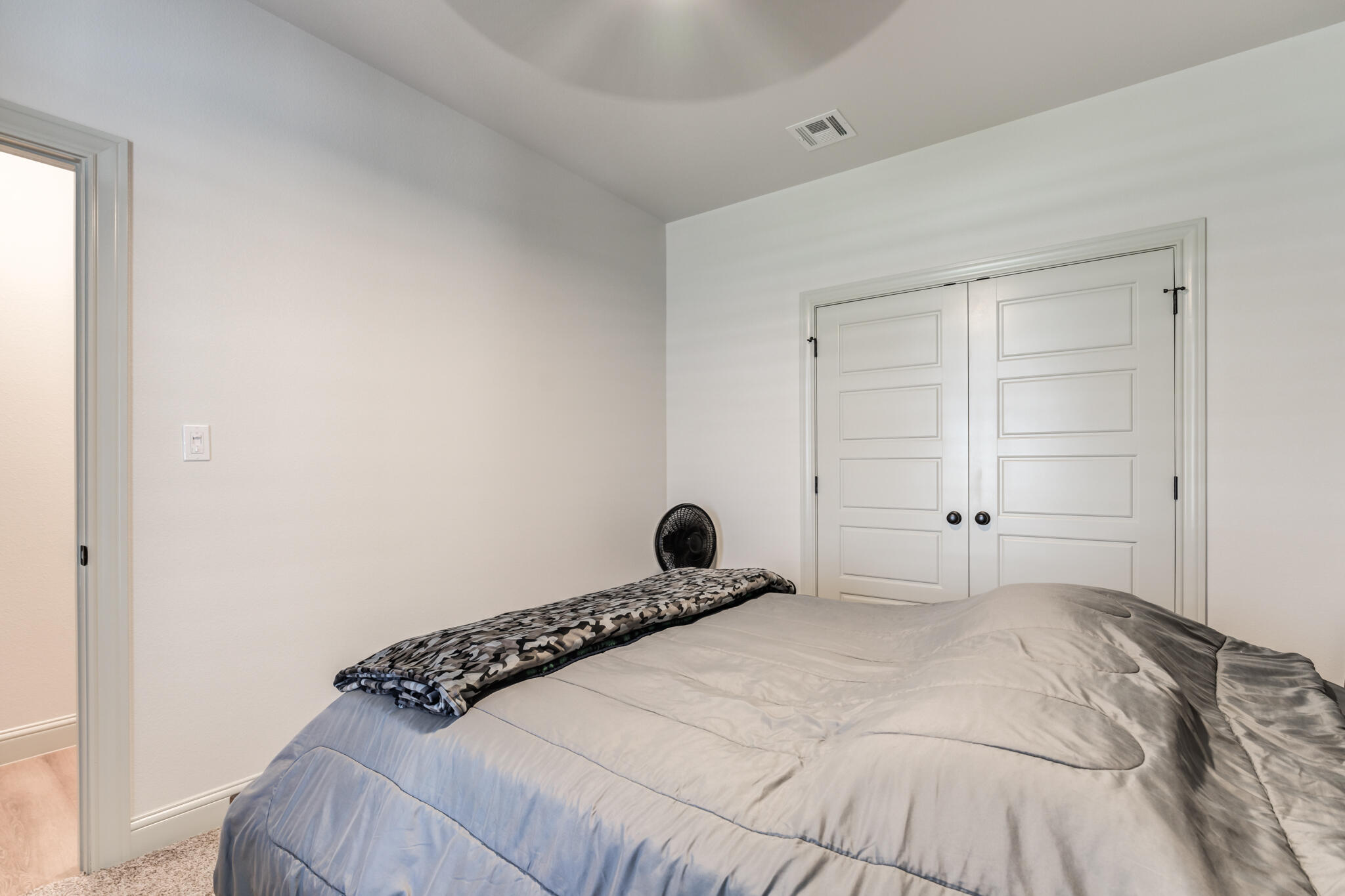 5722 118th Street Lubbock, TX 79424 - Photo 24 of 30 a bedroom with a bed and a window