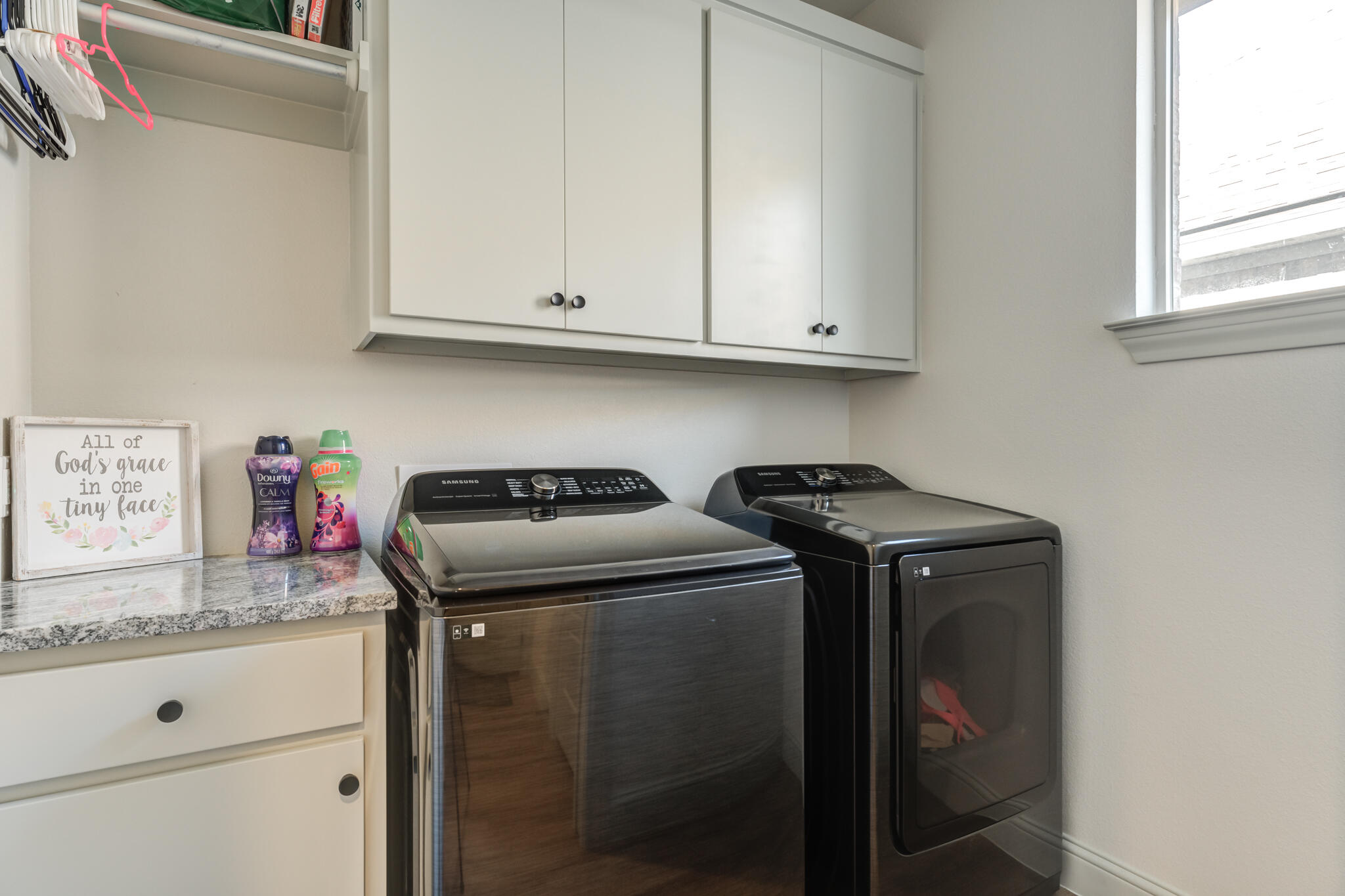 5722 118th Street Lubbock, TX 79424 - Photo 26 of 30 a utility room with stainless steel appliances granite countertop a sink stove and cabinets
