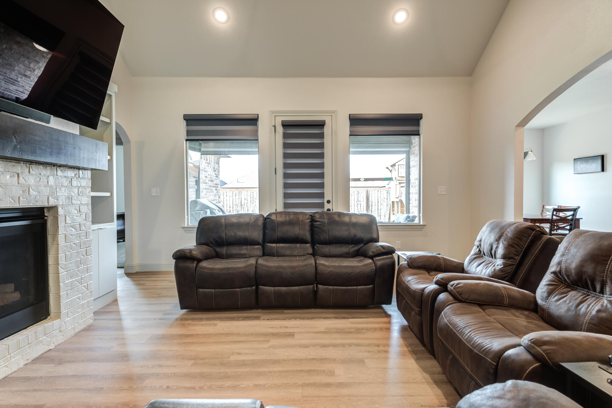 5722 118th Street Lubbock, TX 79424 - Photo 7 of 30 a living room with furniture window and a fireplace