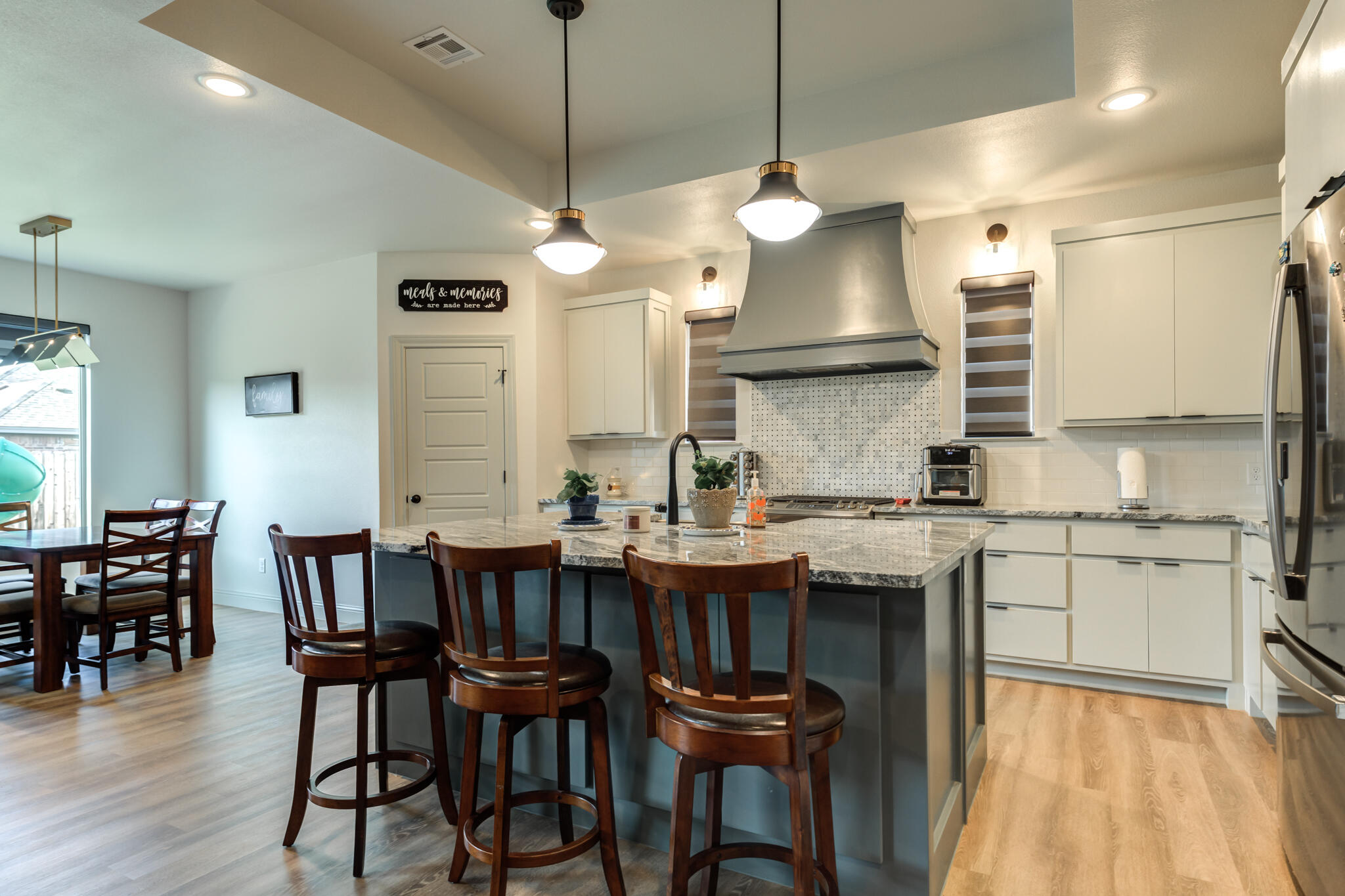 5722 118th Street Lubbock, TX 79424 - Photo 9 of 30 a large kitchen with a table and chairs