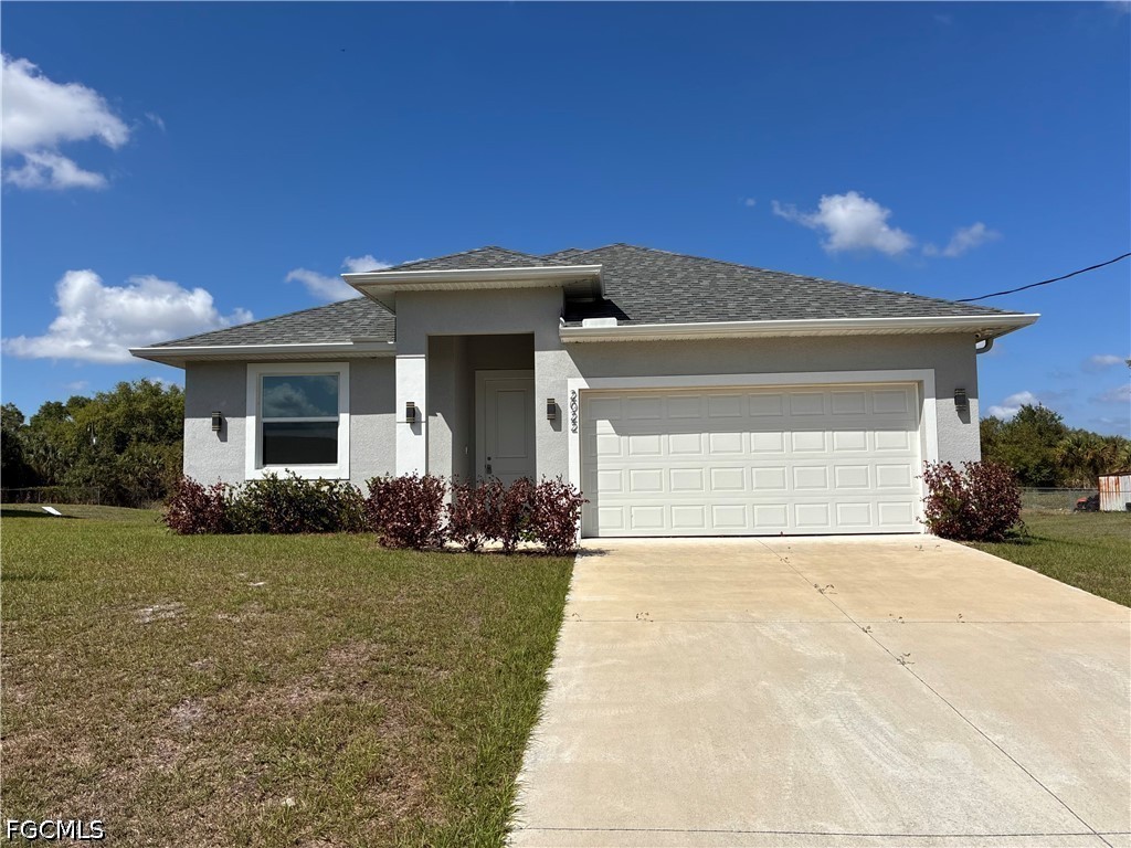 2022 Granada Road LaBelle, FL 33935 - Photo 1 of 43 a view of a house with backyard and garden