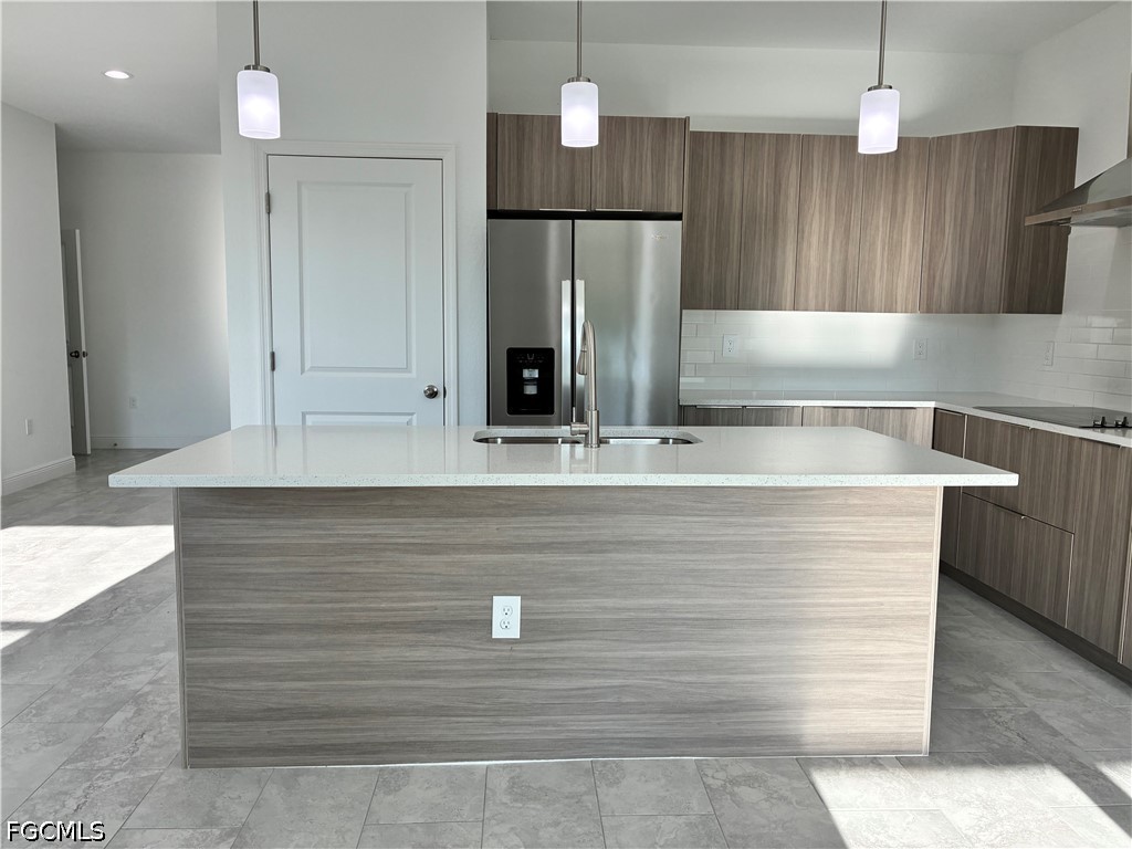 2022 Granada Road LaBelle, FL 33935 - Photo 13 of 43 a view kitchen with stainless steel appliances granite countertop a sink a refrigerator and a stove