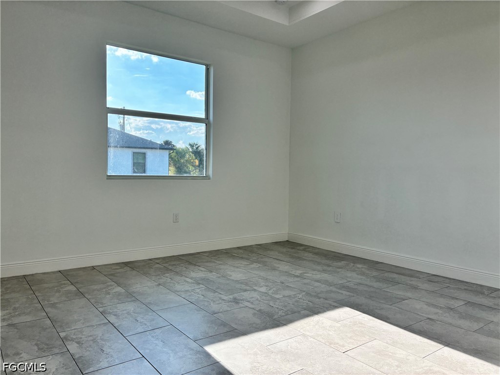 2022 Granada Road LaBelle, FL 33935 - Photo 14 of 43 an empty room with wooden floor and cabinet
