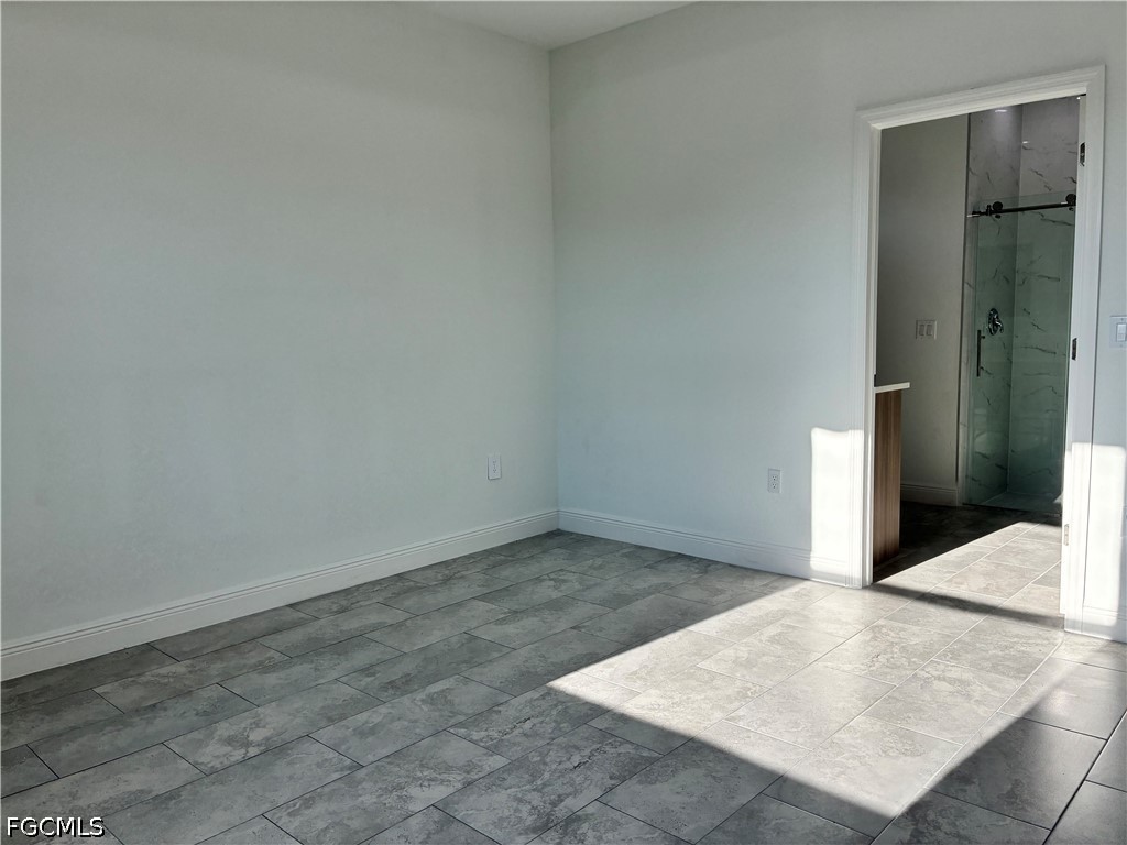 2022 Granada Road LaBelle, FL 33935 - Photo 16 of 43 an empty room with an entrance to other room