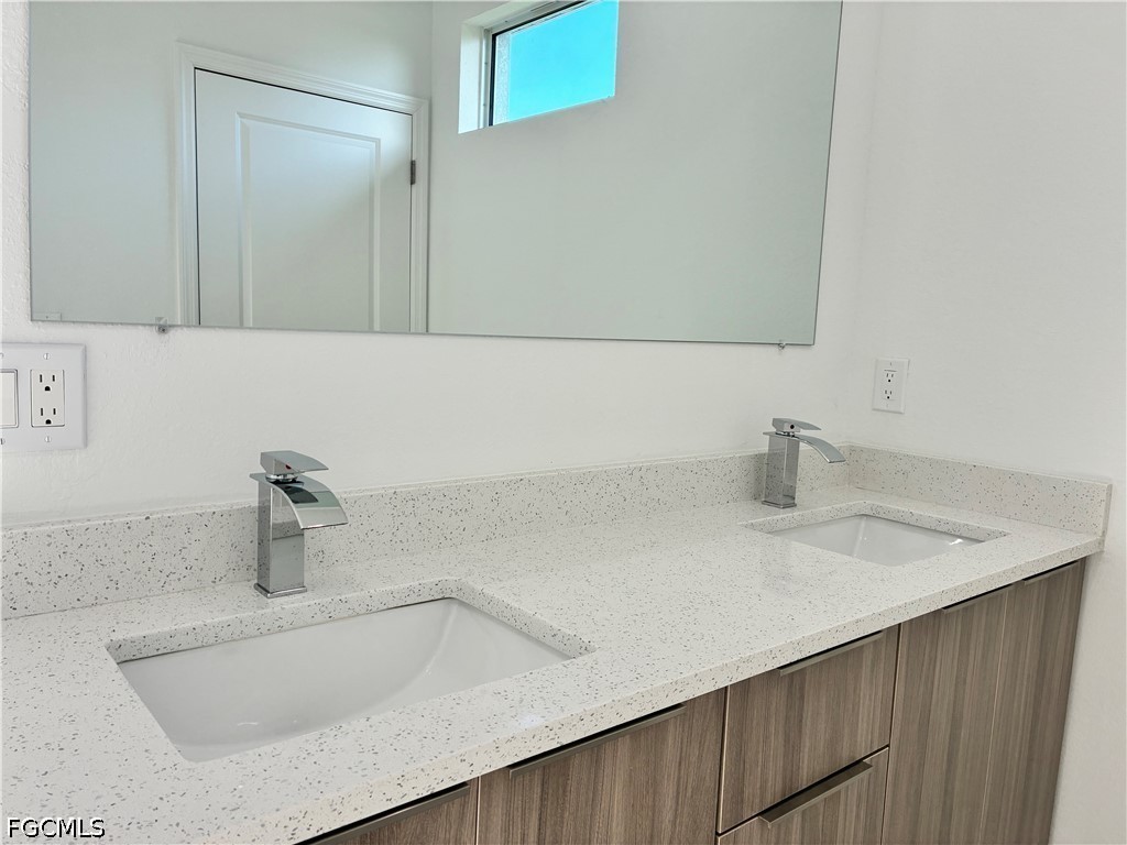 2022 Granada Road LaBelle, FL 33935 - Photo 17 of 43 a bathroom with a sink and a mirror