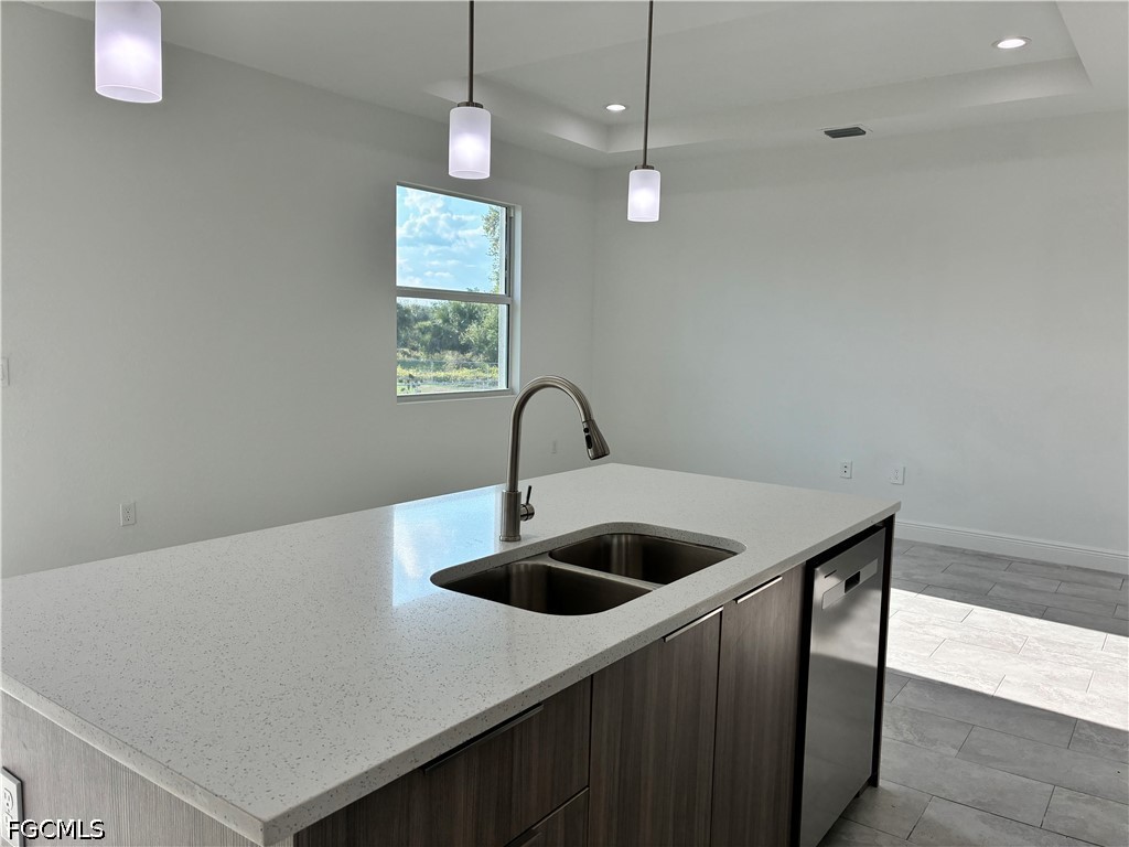 2022 Granada Road LaBelle, FL 33935 - Photo 24 of 43 a kitchen with a sink and chandelier