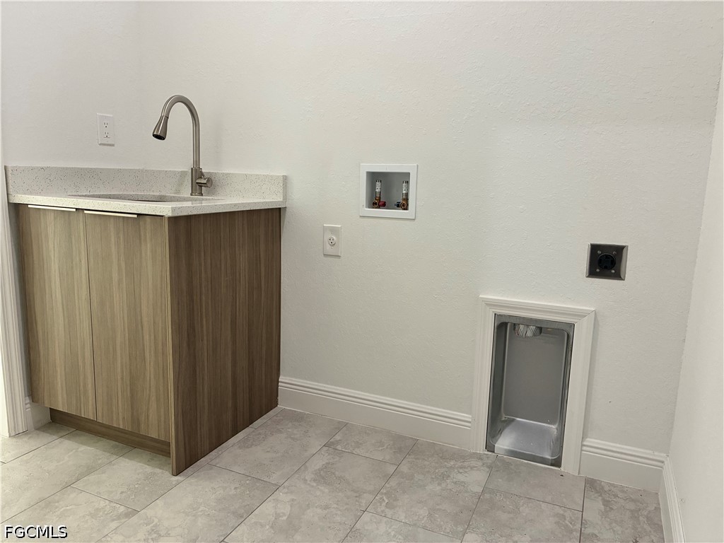 2022 Granada Road LaBelle, FL 33935 - Photo 42 of 43 a bathroom with a sink and mirror