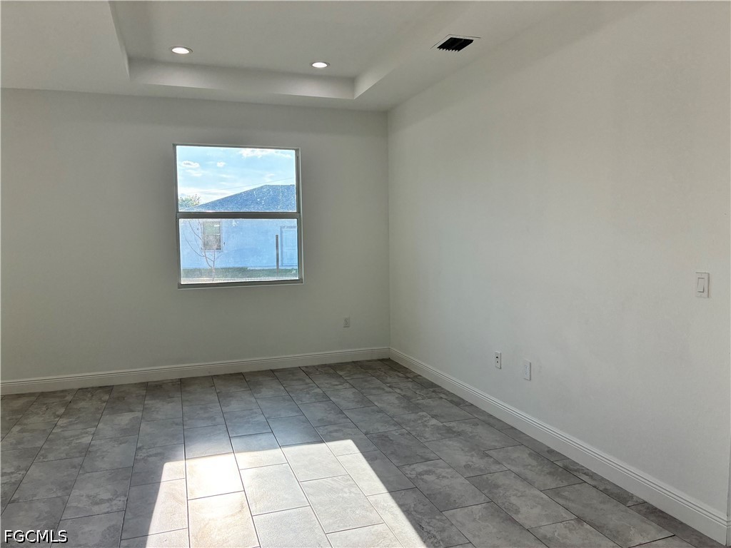 2022 Granada Road LaBelle, FL 33935 - Photo 9 of 43 an empty room with a white cabinet and windows