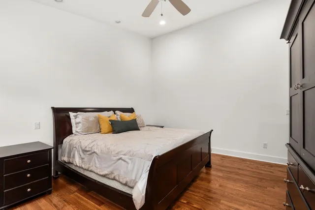 a bedroom with a bed and a dresser