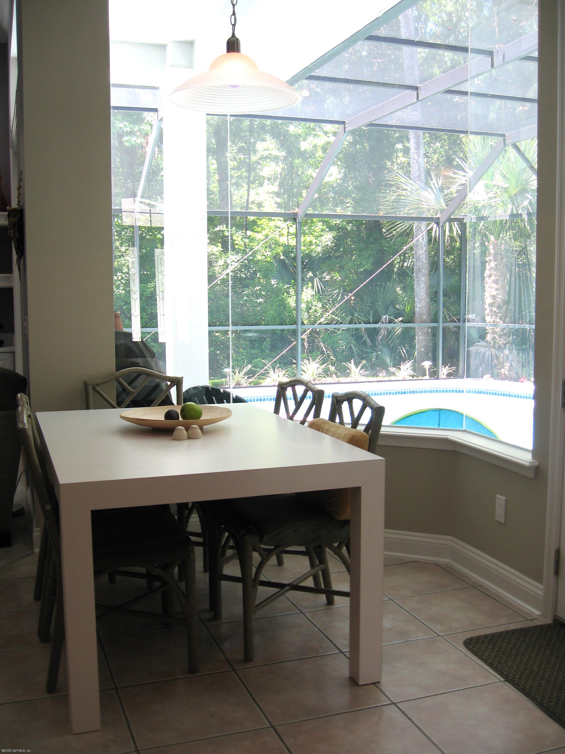 753 Mill Stream Road Ponte Vedra Beach, FL 32082 - Photo 13 of 16 a dining room with a table and chairs