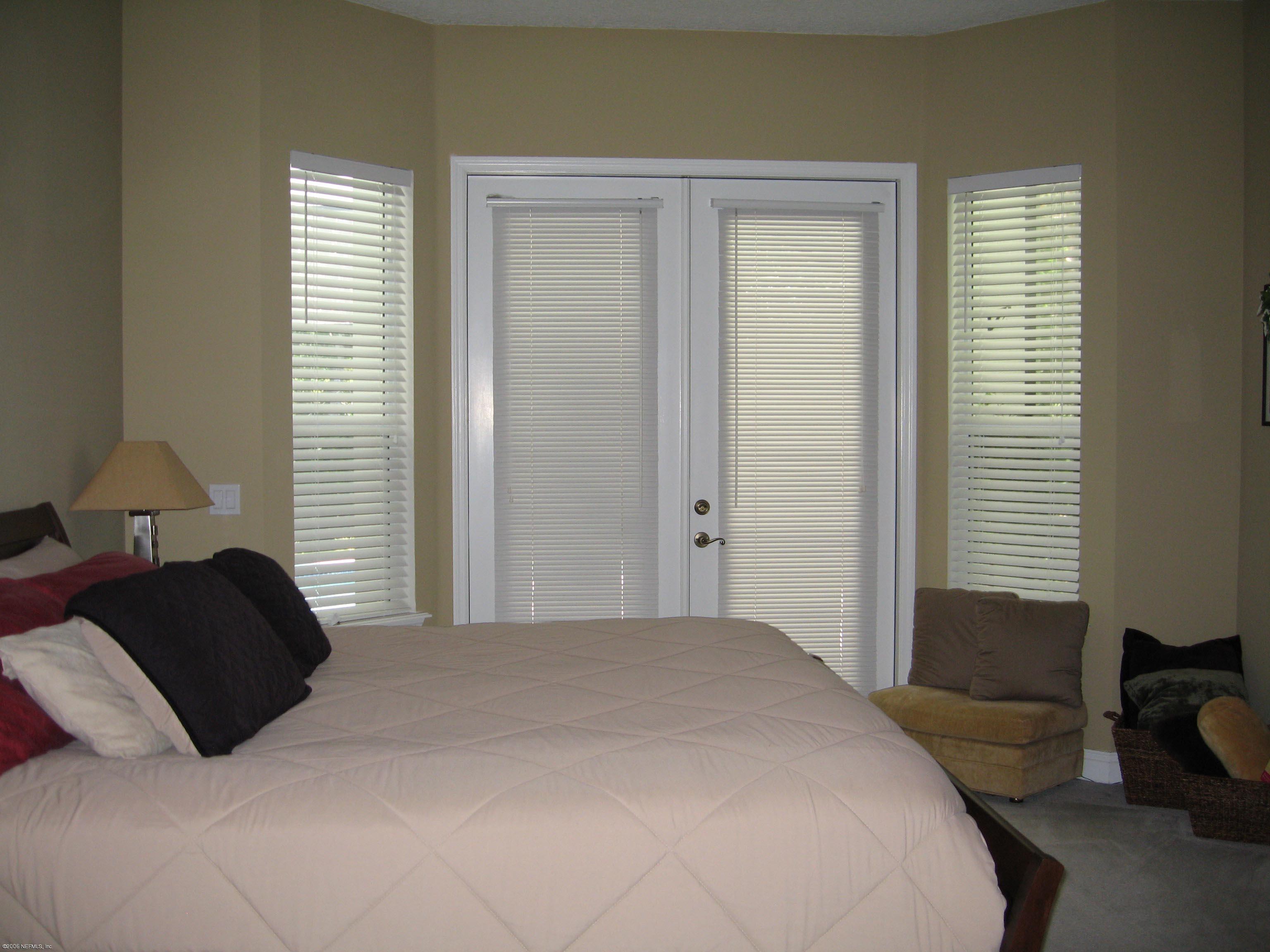 753 Mill Stream Road Ponte Vedra Beach, FL 32082 - Photo 9 of 16 a bedroom with a bed and a window