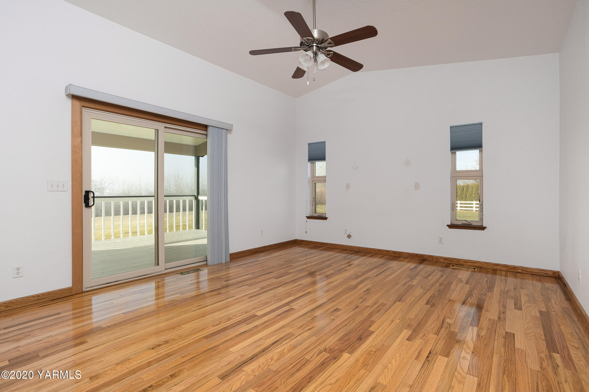 9800 Bittner Road Yakima, WA 98901 - Photo 11 of 45 an empty room with wooden floor and windows