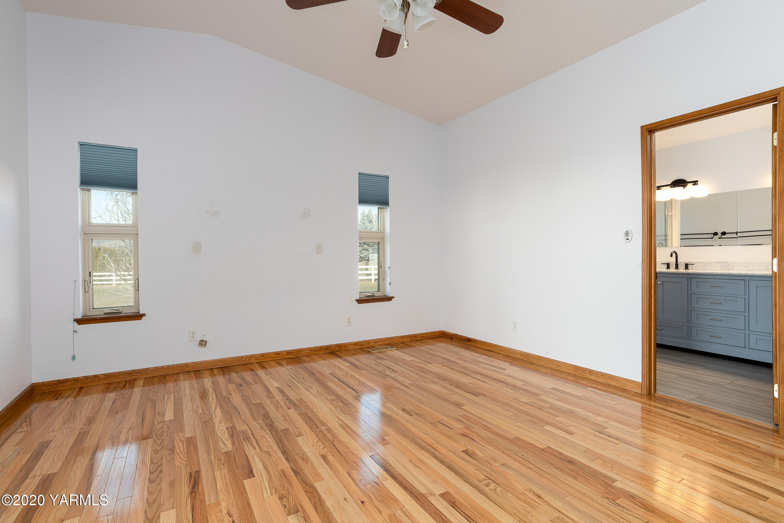 9800 Bittner Road Yakima, WA 98901 - Photo 12 of 45 a view of empty room with wooden floor and window