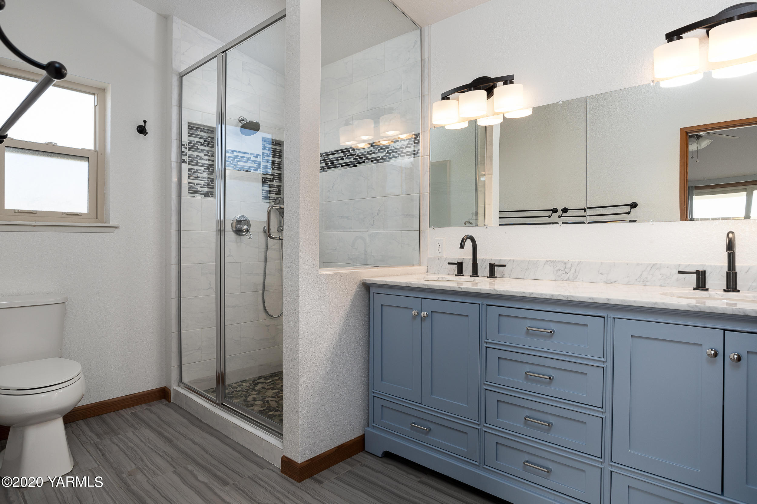 9800 Bittner Road Yakima, WA 98901 - Photo 13 of 45 a bathroom with a double vanity sink mirror and toilet