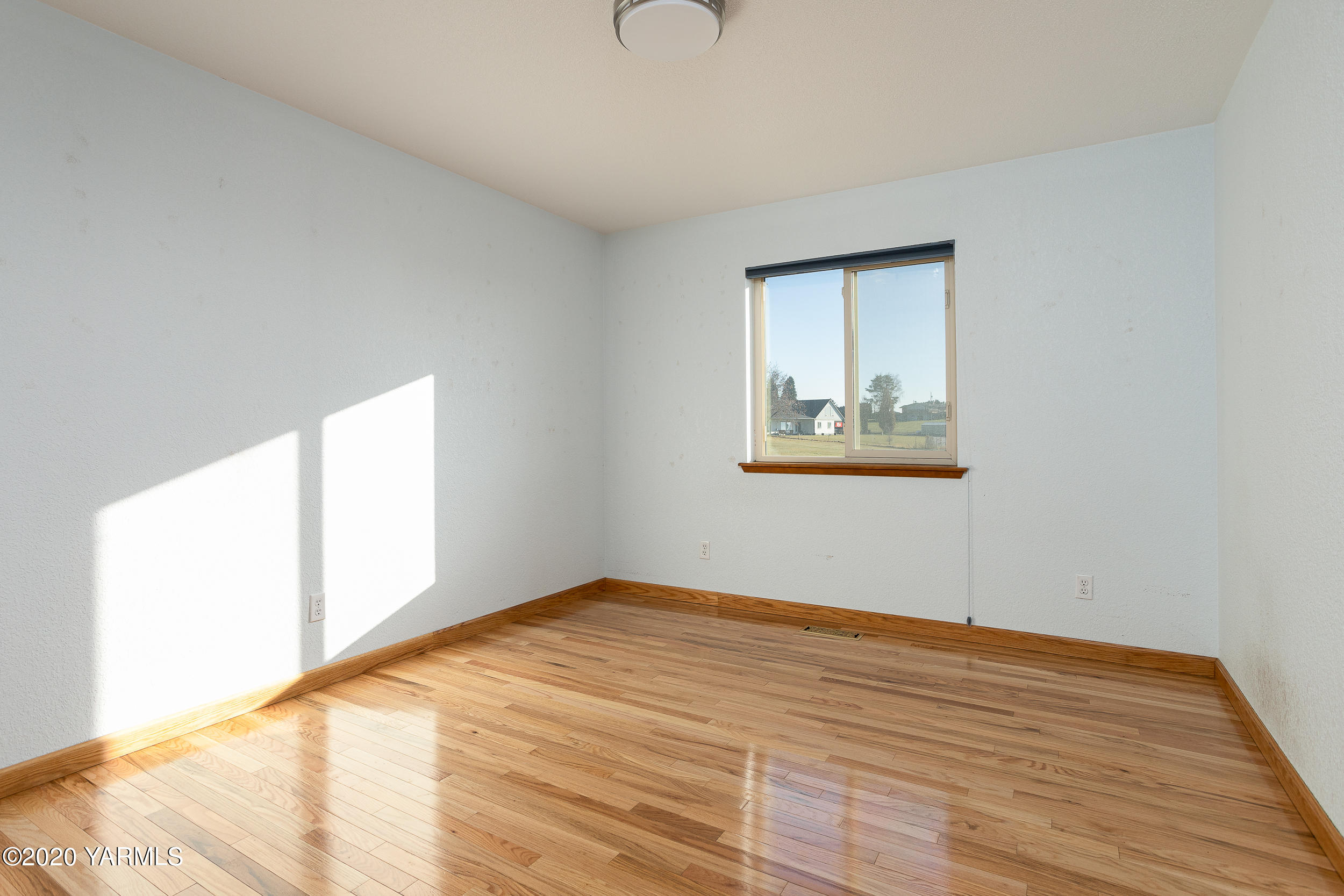 9800 Bittner Road Yakima, WA 98901 - Photo 17 of 45 a view of empty room with wooden floor