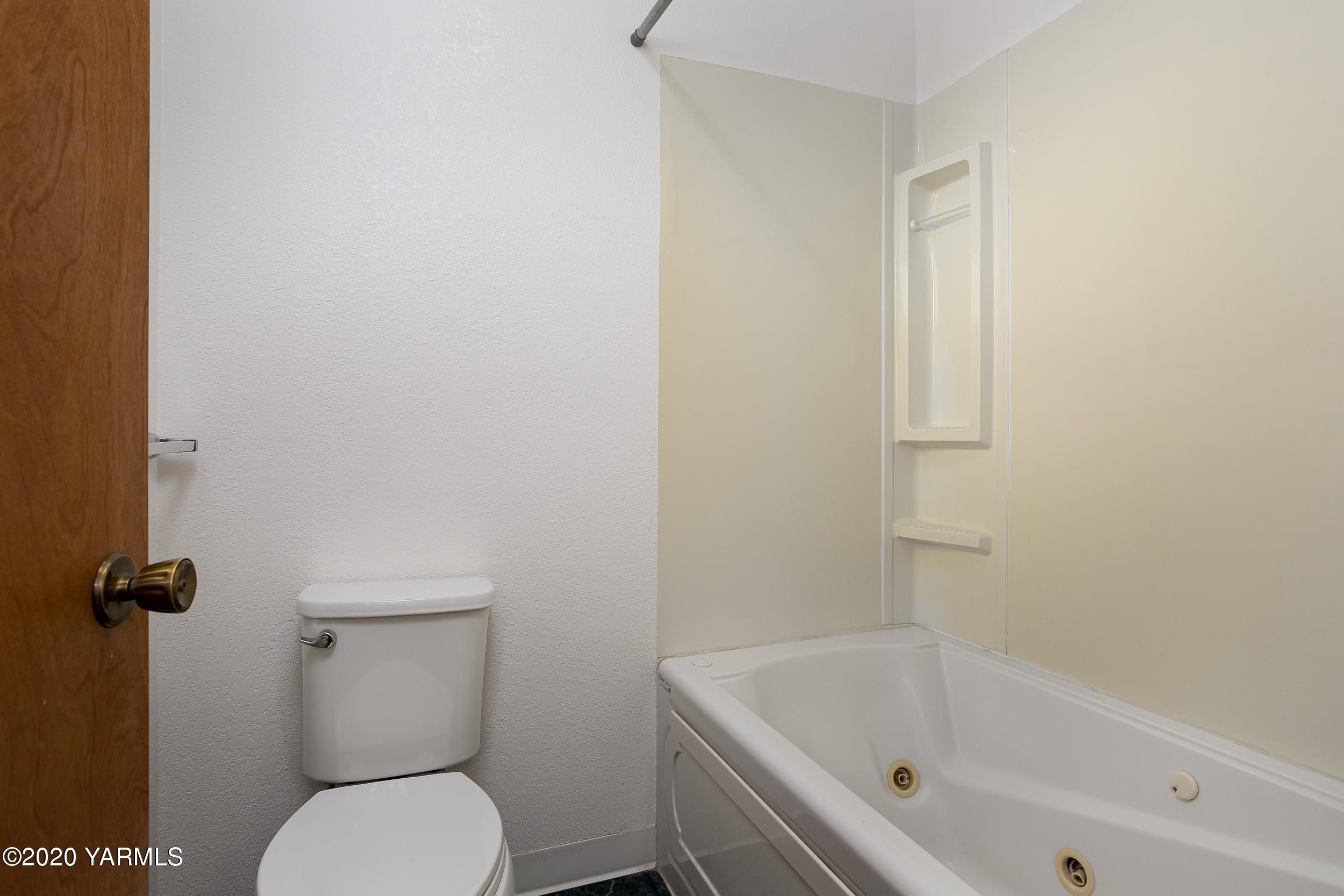 9800 Bittner Road Yakima, WA 98901 - Photo 20 of 45 a white toilet sitting next to a bath tub