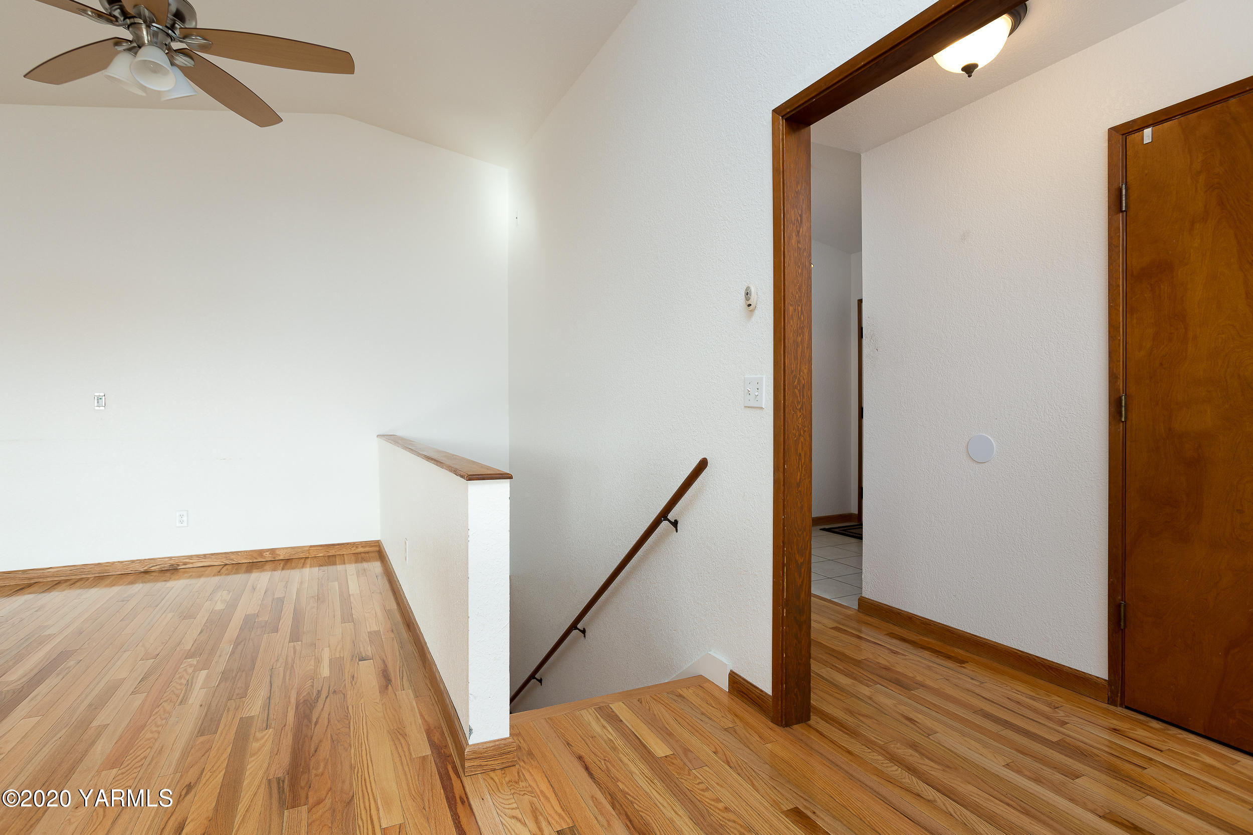 9800 Bittner Road Yakima, WA 98901 - Photo 22 of 45 a view of a hallway with wooden floor and staircase