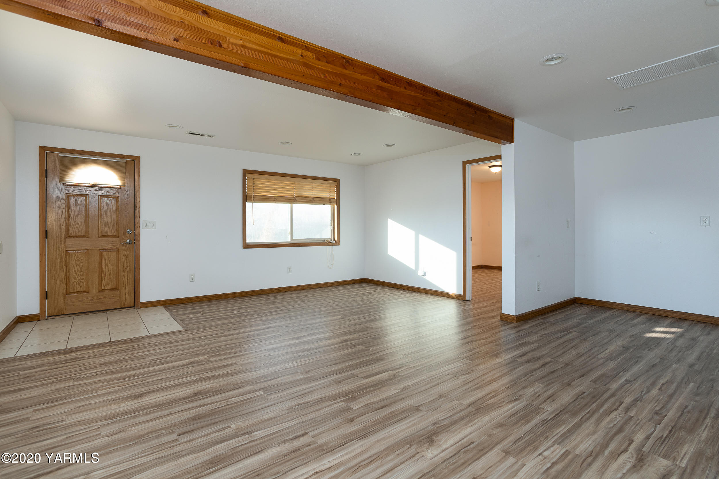 9800 Bittner Road Yakima, WA 98901 - Photo 26 of 45 an empty room with wooden floor and windows