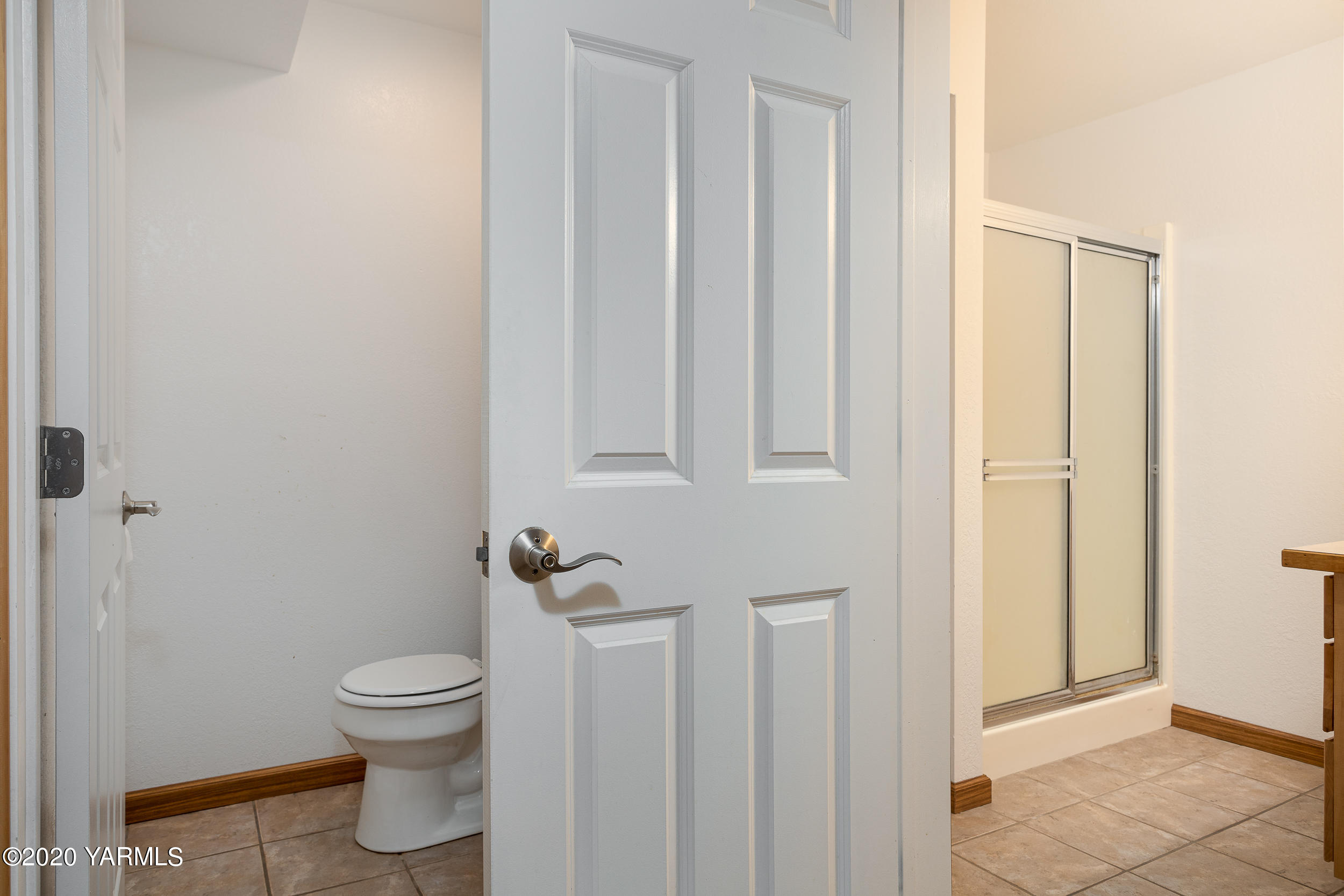 9800 Bittner Road Yakima, WA 98901 - Photo 32 of 45 a white toilet sitting next to a bathroom sink