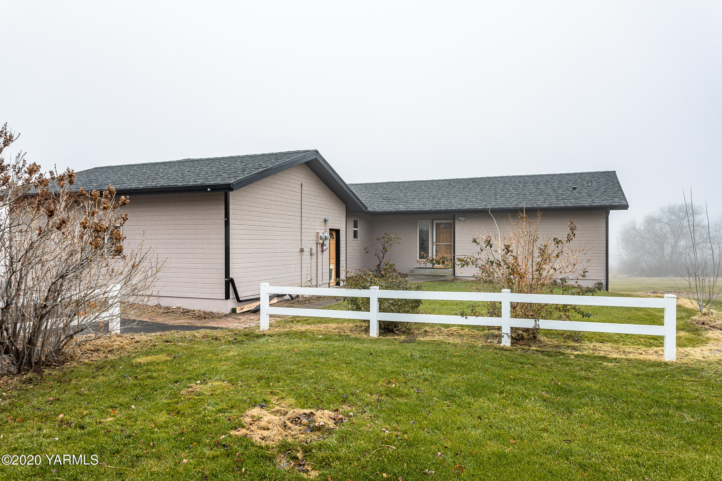 9800 Bittner Road Yakima, WA 98901 - Photo 45 of 45 a view of a house with a yard and sitting area