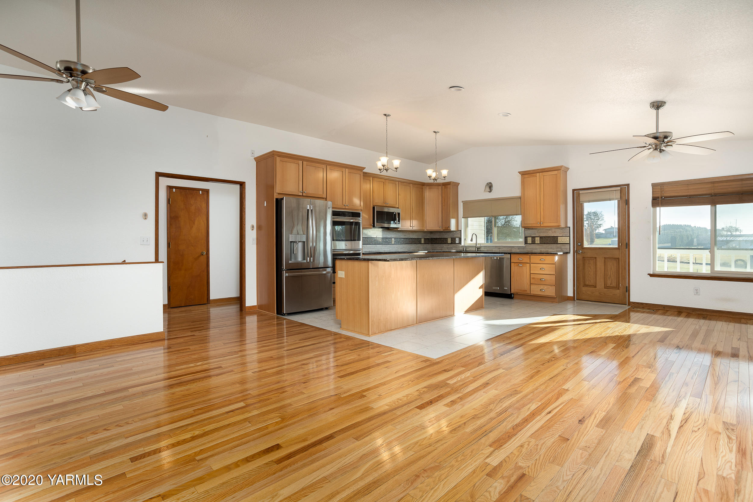 9800 Bittner Road Yakima, WA 98901 - Photo 6 of 45 a view of a kitchen with wooden floor and a kitchen space