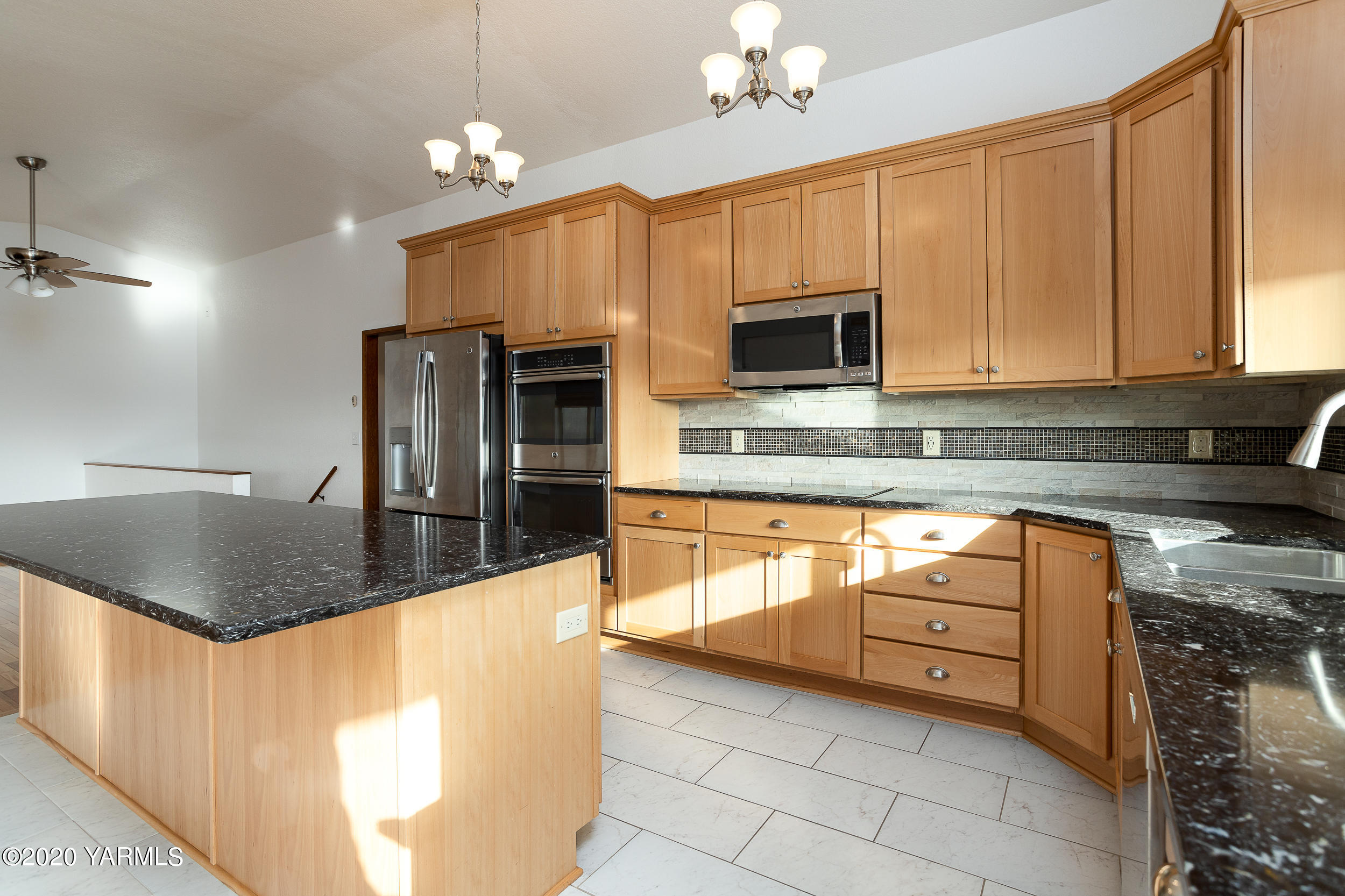 9800 Bittner Road Yakima, WA 98901 - Photo 8 of 45 a kitchen with stainless steel appliances granite countertop a sink a stove counter space and cabinets