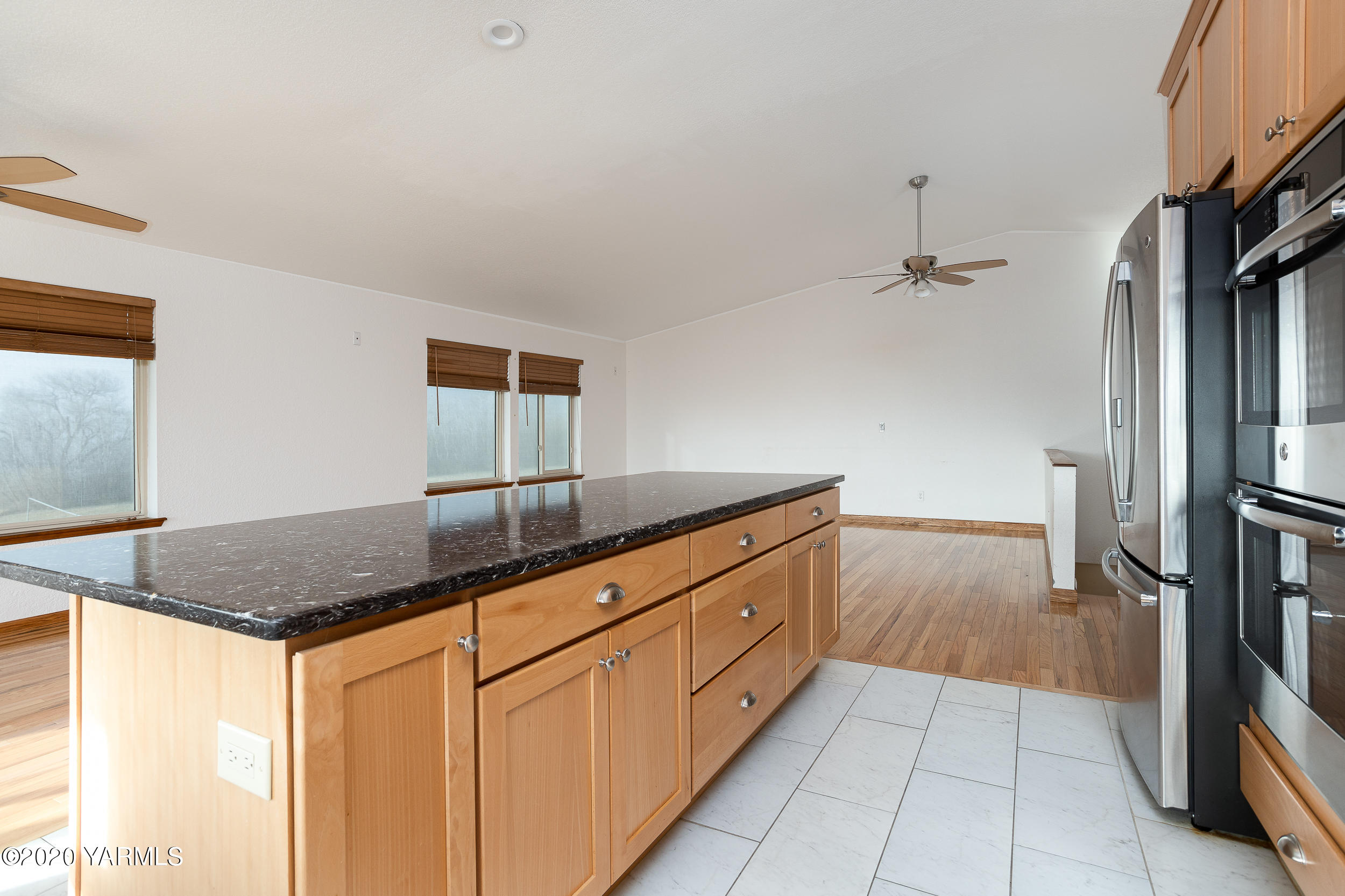 9800 Bittner Road Yakima, WA 98901 - Photo 9 of 45 a kitchen with granite countertop a sink and a refrigerator