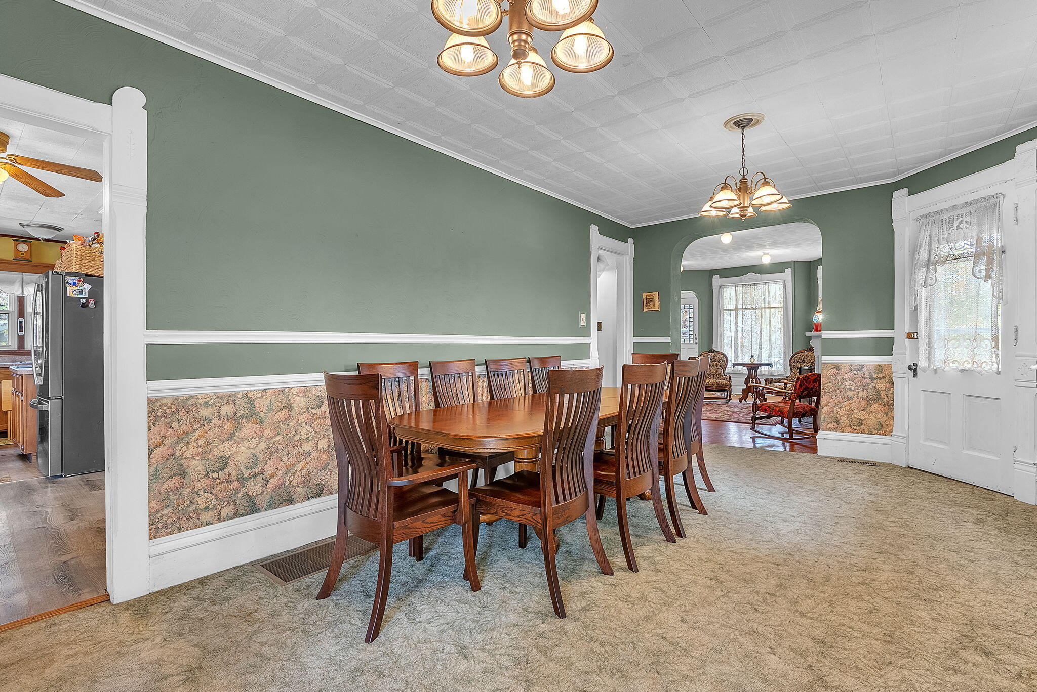 623 West Milroy Avenue Rensselaer, IN 47978 - Photo 14 of 58 a view of a dining room with furniture and chandelier