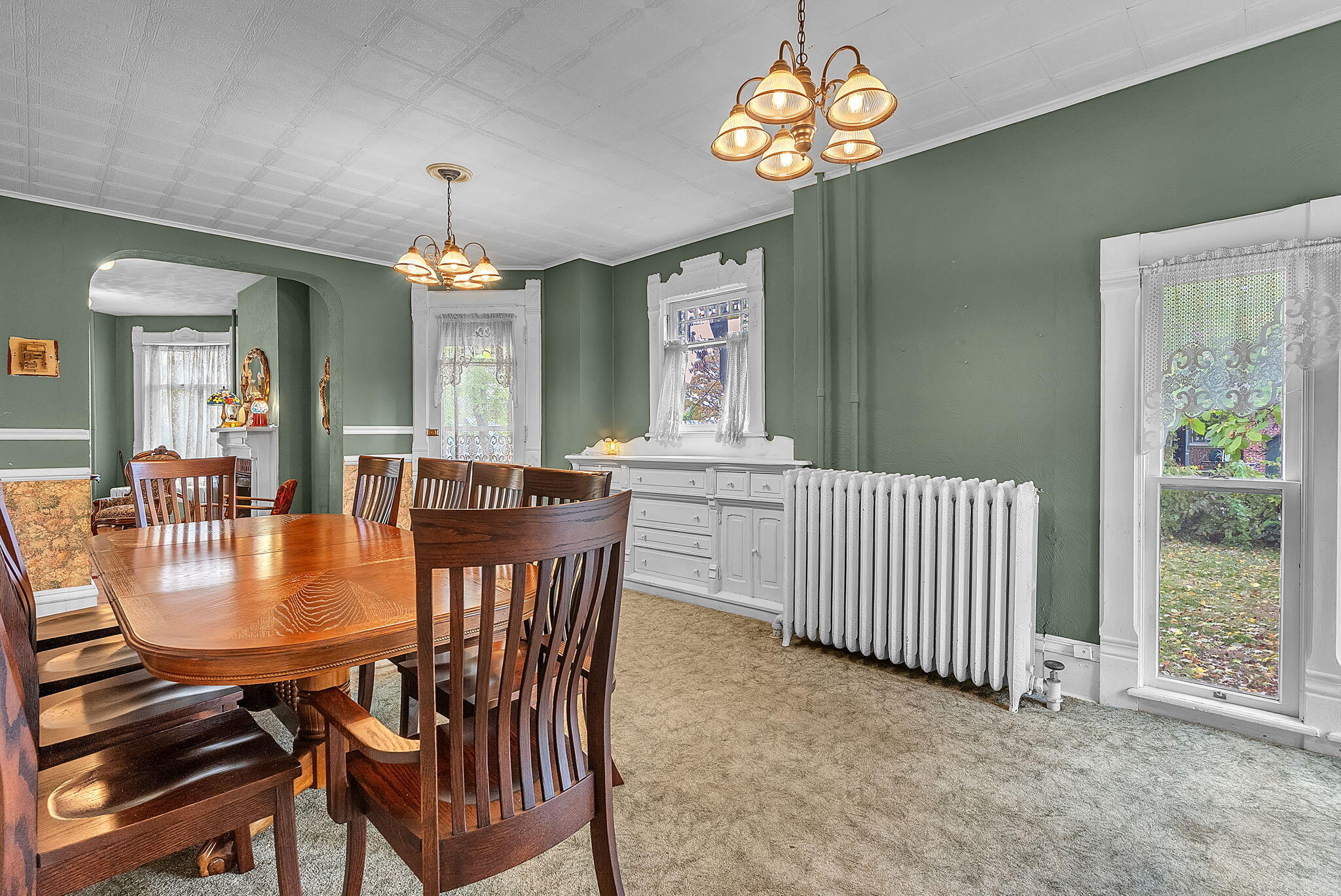 623 West Milroy Avenue Rensselaer, IN 47978 - Photo 15 of 58 a dining room with furniture a chandelier and window