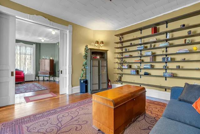 a living room with furniture and a rug