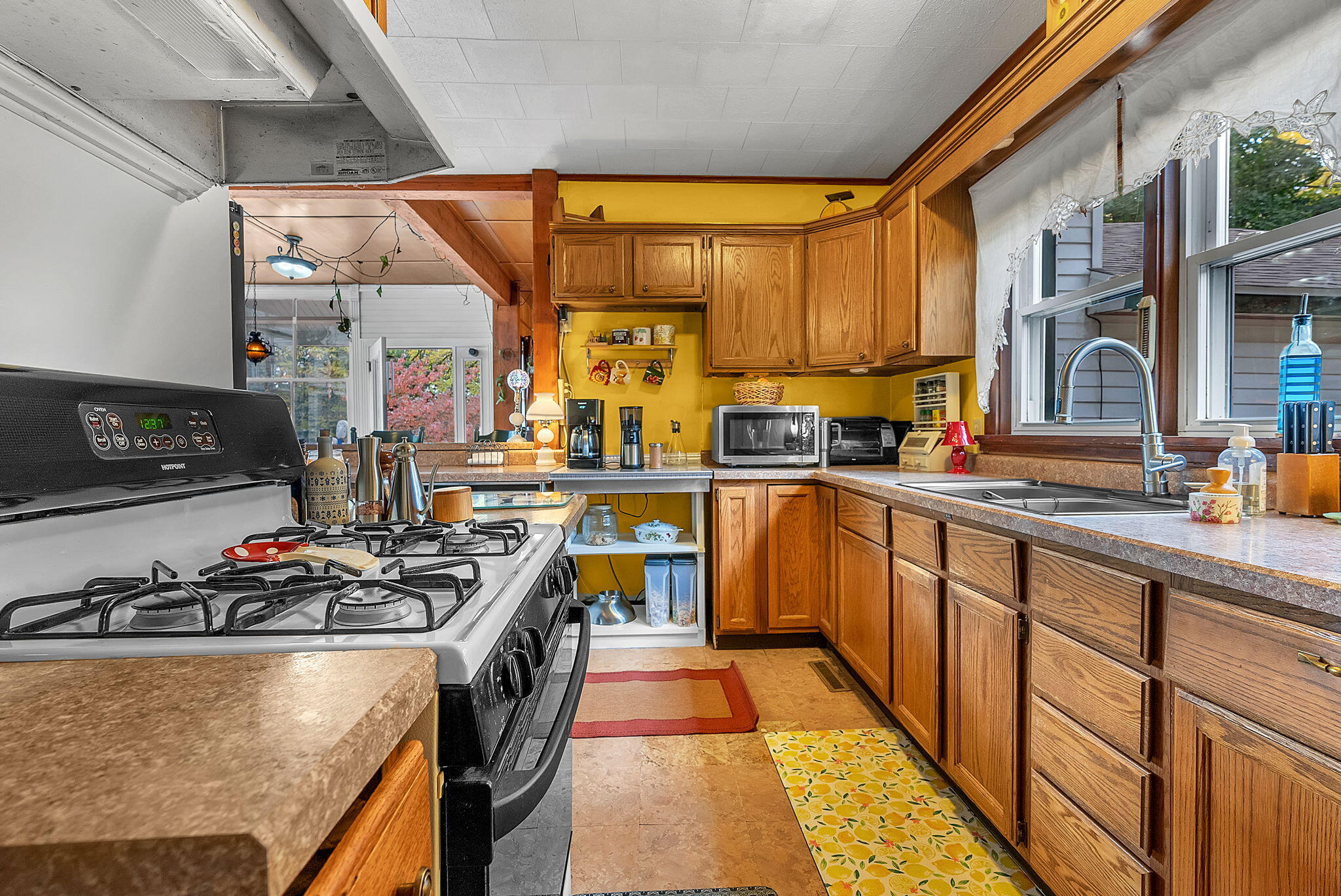 623 West Milroy Avenue Rensselaer, IN 47978 - Photo 22 of 58 a kitchen with stainless steel appliances granite countertop a stove a sink dishwasher and cabinets with wooden floor