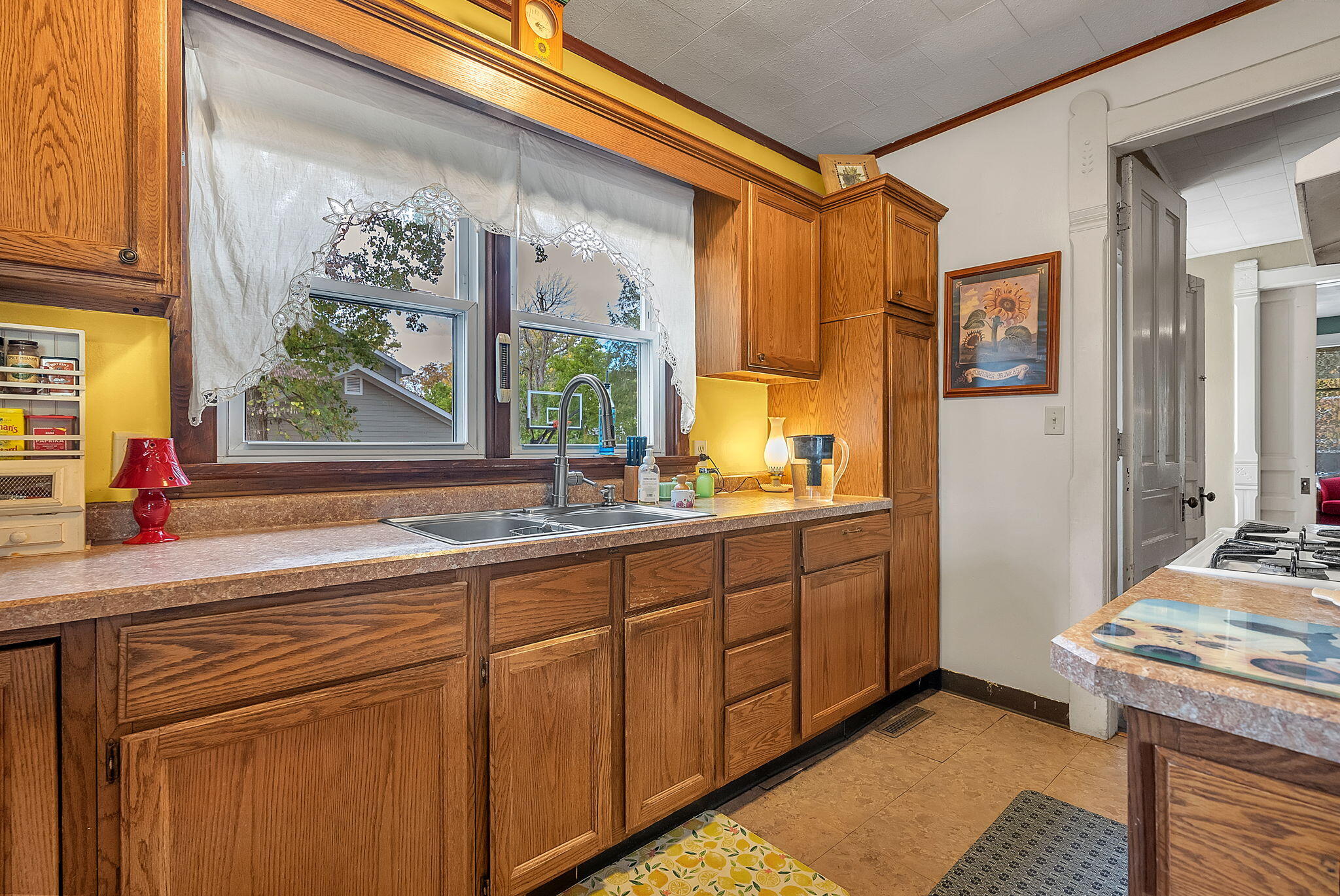 623 West Milroy Avenue Rensselaer, IN 47978 - Photo 22 of 64 a kitchen with a sink stove and cabinets