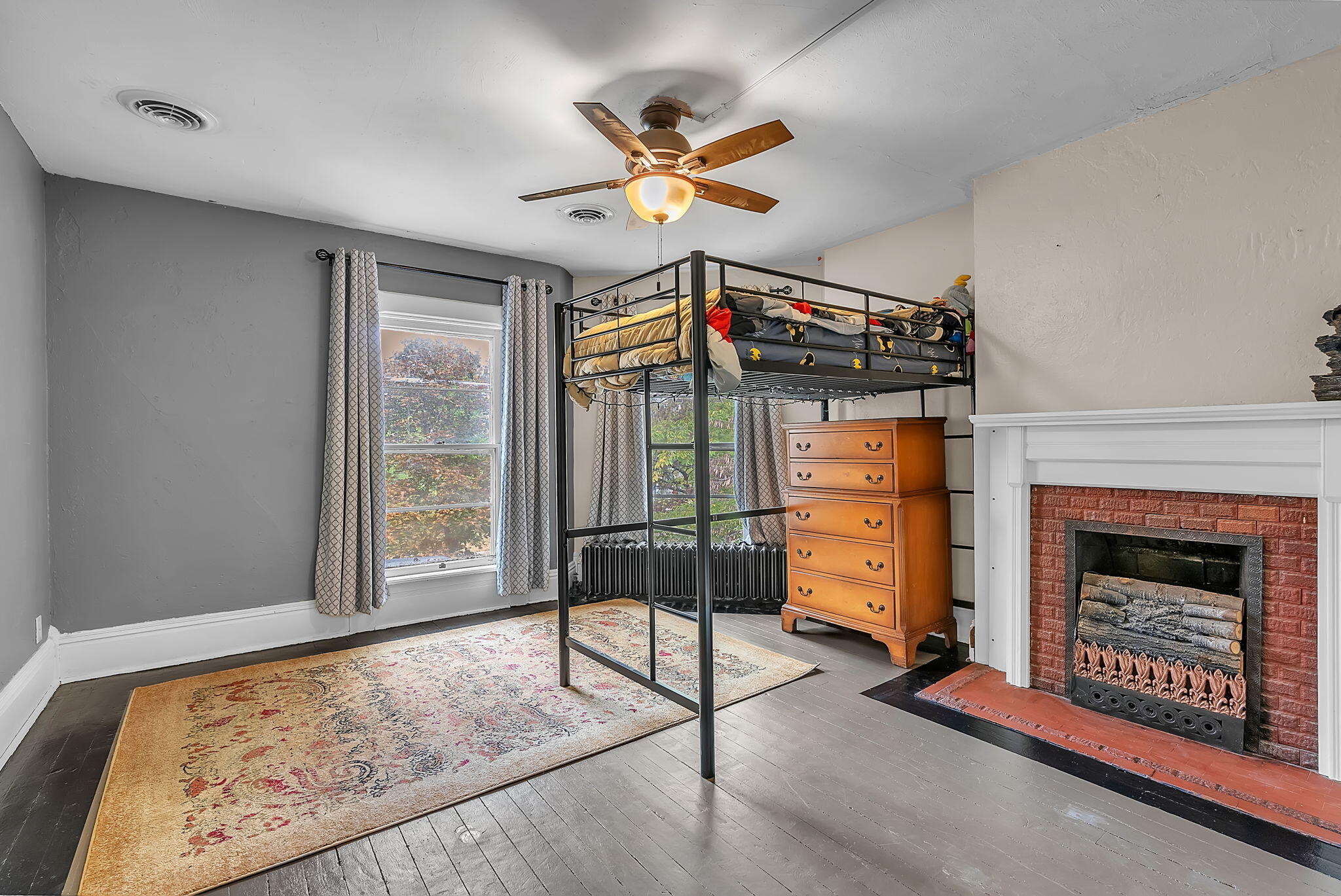 623 West Milroy Avenue Rensselaer, IN 47978 - Photo 30 of 58 a living room with furniture and a fireplace