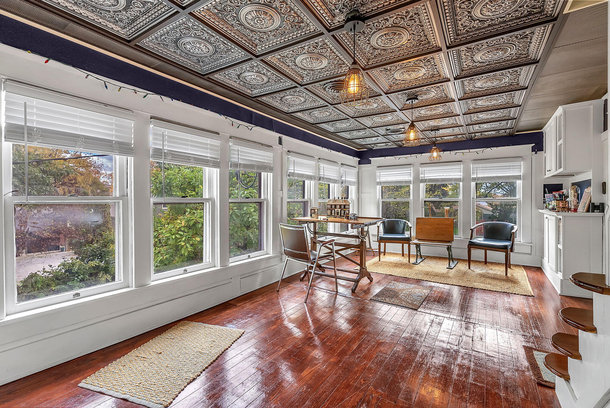 623 West Milroy Avenue Rensselaer, IN 47978 - Photo 3 of 58 a work room with furniture and large windows