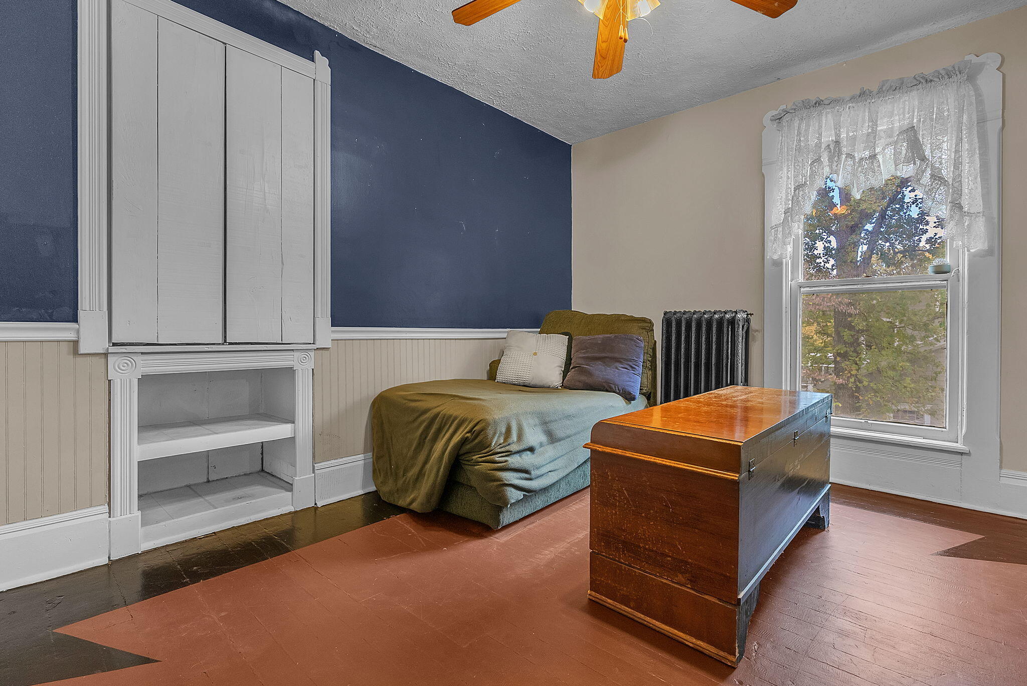 623 West Milroy Avenue Rensselaer, IN 47978 - Photo 32 of 58 a bedroom with a bed and a chandelier