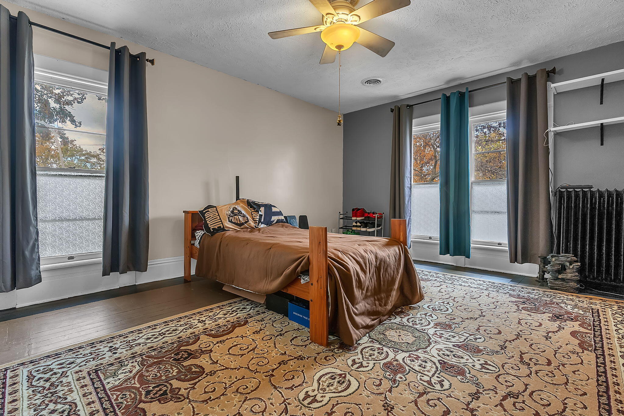 623 West Milroy Avenue Rensselaer, IN 47978 - Photo 32 of 64 a bed sitting in a spacious bedroom next to a window