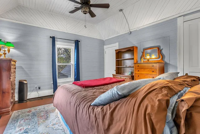 a living room with furniture a fireplace and a table