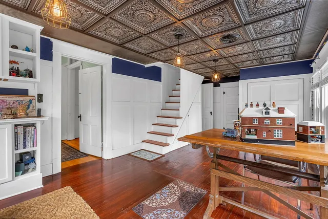 a room with furniture and a flat screen tv